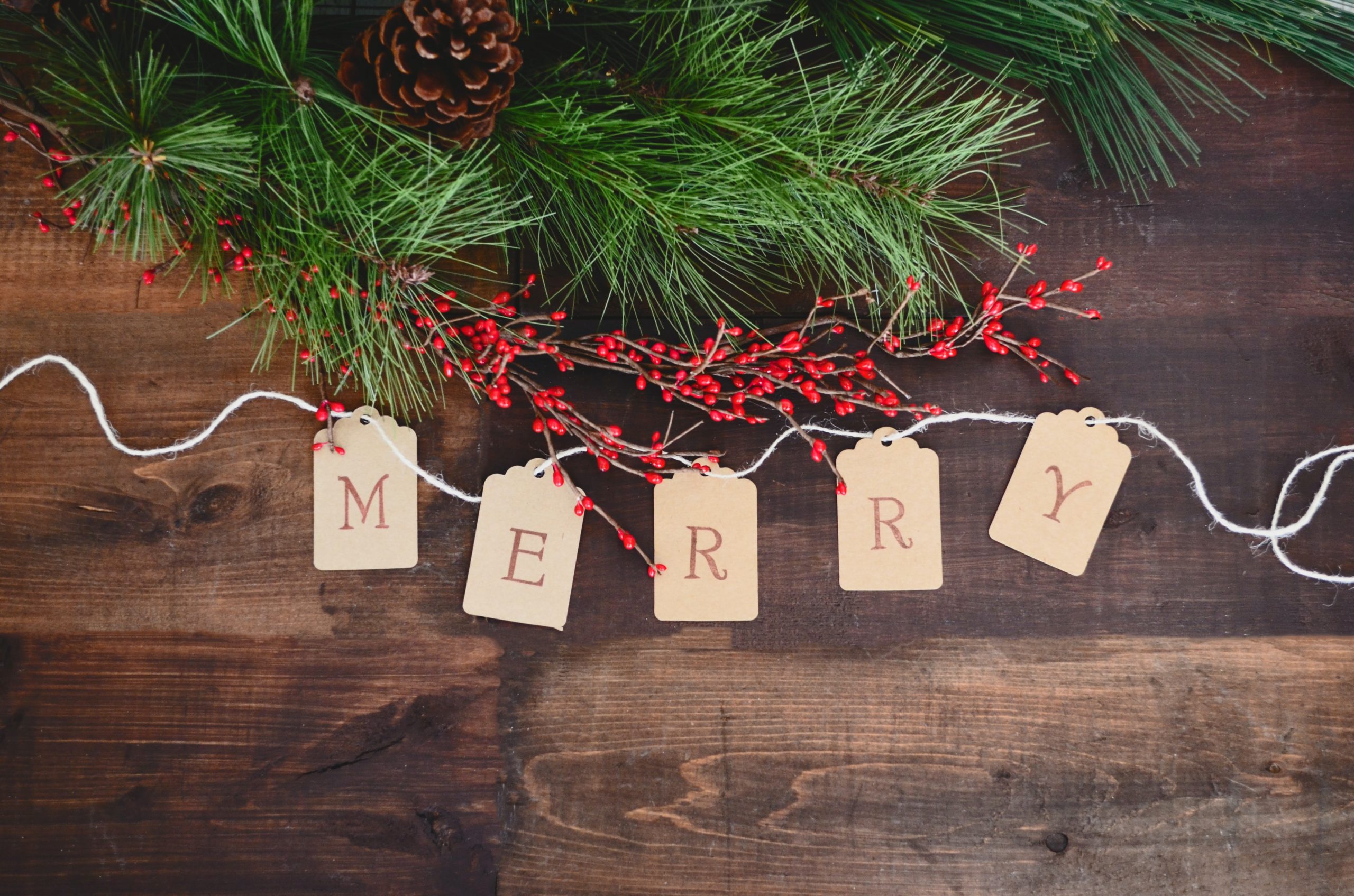 merry spelt out on string decoration