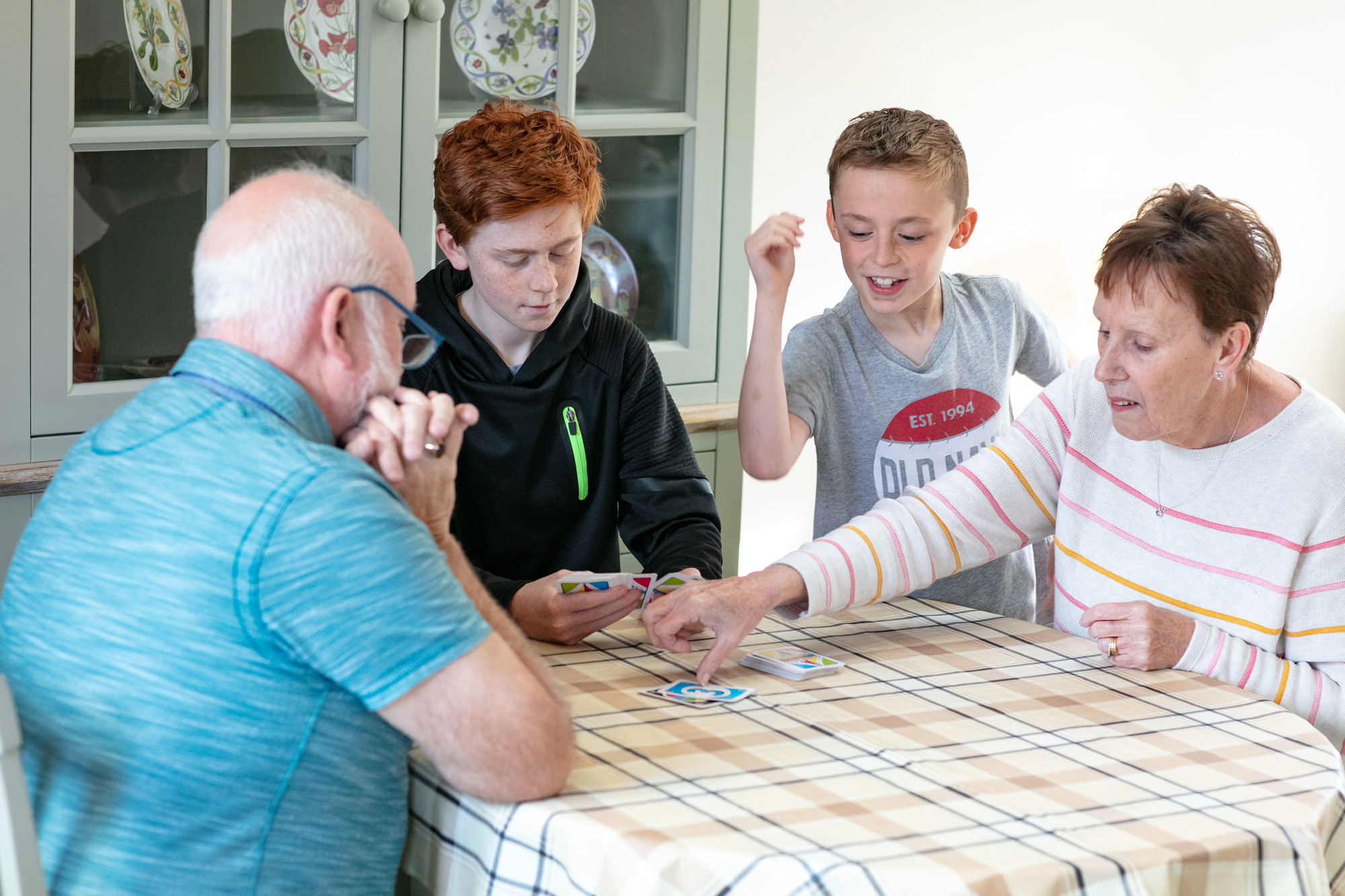 Elderly people with two boys