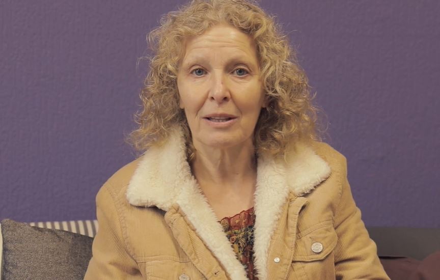 blonde woman looking into camera